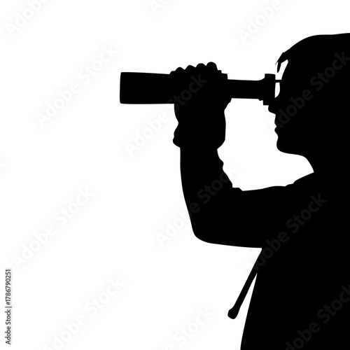 silhouette of a person using binoculars
