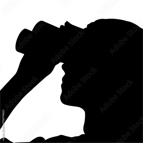 silhouette of a person using binoculars