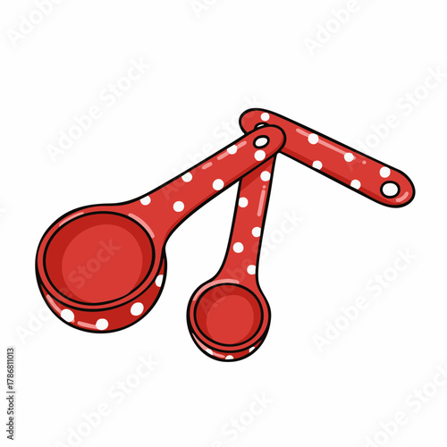 Red measuring spoons with polka dots on white background. Measuring spoons are a common tool, featuring red color and playful polka dots. Using measuring spoons shows commitment to precise cooking,