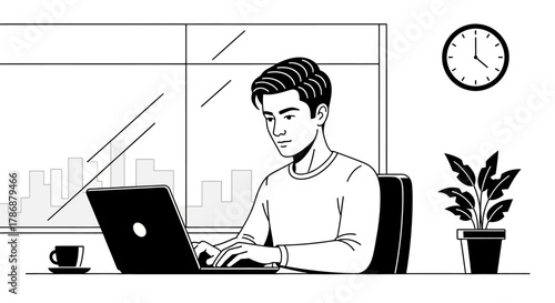 Man working on laptop at desk with clock and plant