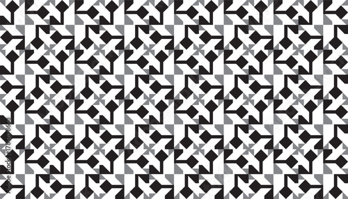 A seamless black and white geometric spiral pattern featuring interlocking angular shapes arranged in a rhythmic, repeating layout. The abstract design creates a sense of motion and symmetry
