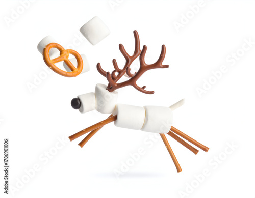 A playful holiday reindeer crafted from marshmallows and pretzels in a dynamic leaping pose, a creative Christmas food art concept