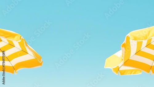Summer scene with yellow and white striped umbrellas against a deep blue sky. Bright and sunny day capturing the warmth and joy of tropical vacation moments