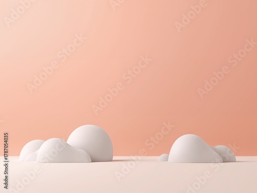 A minimalist 3D render with white stones on a peach or pink background. Abstract scene for product display.