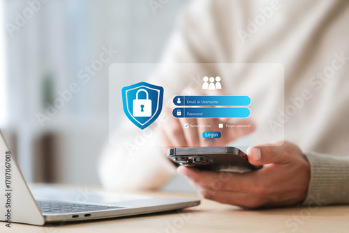 Cybersecurity protects Login , Businessman using mobile phone to log in securely with user interface screen data protection, privacy, authentication, and online security.
