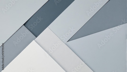 Abstract geometric composition with overlapping gray and white shapes.