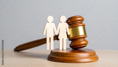 judge’s gavel with couple cutout on sound block, symbolizing legal decisions in family matters