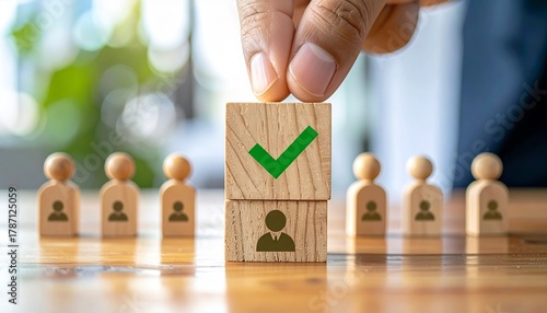hand selecting approved silhouette block with green checkmark, symbolizing recruitment and decision-making