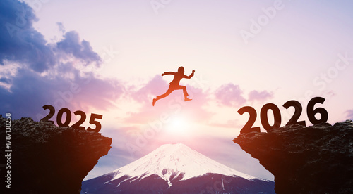 2026年へジャンプする男性　ビジネス向け2026年新年イメージ　令和8年年賀状素材