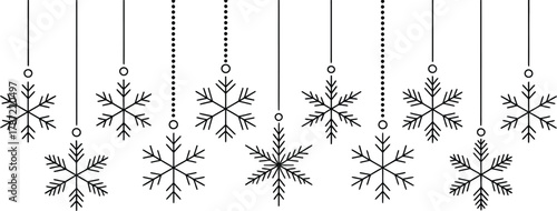 Festive Black and White Snowflake Decorations Hanging on White Background