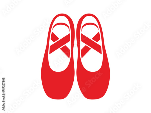 Pair of red ballet shoes with ribbons for dance and performance