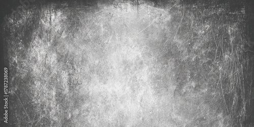 Abstract black and gray vintage background for overlay featuring authentic scratches and subtle stains on a black to gray gradient background.