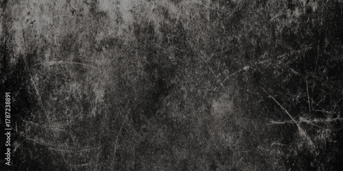 Abstract black and gray vintage background for overlay featuring authentic scratches and subtle stains on a black to gray gradient background.