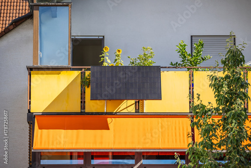 Old family house with balcony with solar panels generating clean energy