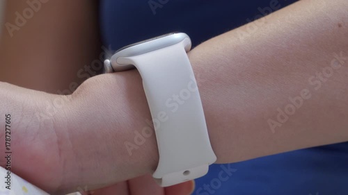A smart watch is worn on a wrist. The device emits a timer bell sound.