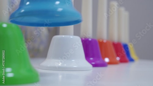 Joyful Harmony: Colorful Handbells Ring Alternately for Music Learning