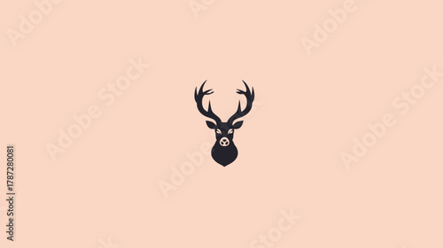 Minimalist black deer head silhouette with majestic antlers. Elegant animal graphic illustration on a soft peach background.
