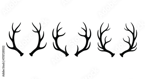 a row of black antlers against white background