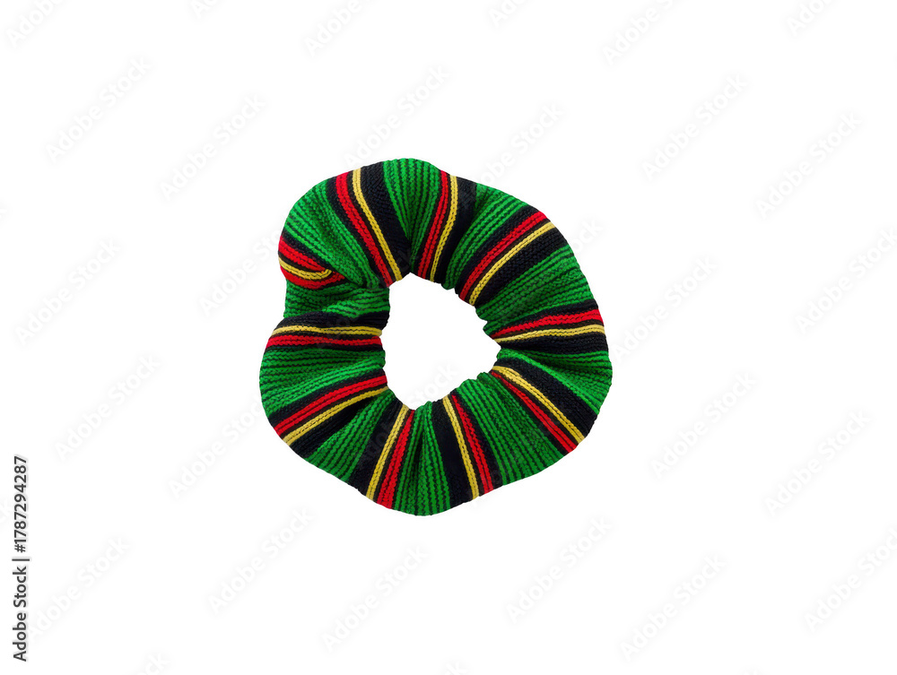 Obraz premium Colorful striped fabric scrunchie with green, red, and yellow pattern, isolated on transparency background, hair accessory, vibrant and playful style for casual or festive looks
