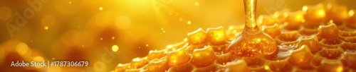 Golden honey dripping from honeycomb, textured surface, honey flow, hive