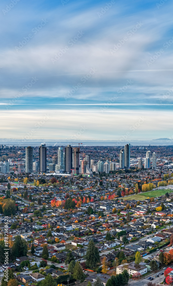 Obraz premium City Skyline Over a Fall Suburban Neighborhood in Burnaby, Greater Vancouver, BC, Canada