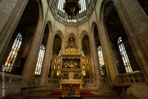 Kutná Hora, Czech Republic – August 8, 2025: Main altar with neo-Gothic Last Supper relief and ornate gilded reredos in chancel of St. Barbara’s Cathedral, Kutná Hora, UNESCO World Heritage Site