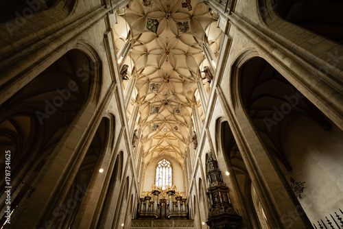 Kutná Hora, Czech Republic – August 8, 2025: Cathedral of St. Barbara interior featuring ornate Gothic vaulted ceiling and Baroque pipe organ, Kutná Hora