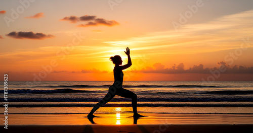 Yoga practice on a beach at sunrise