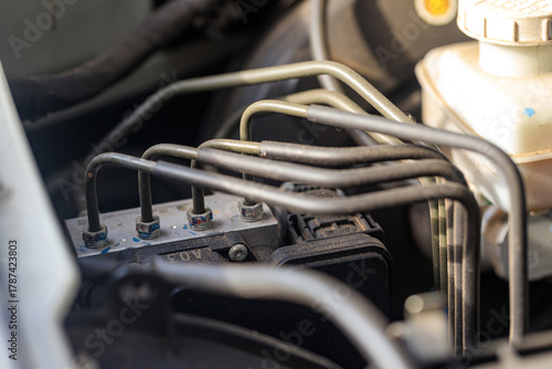 ABS Anti lock braking system. close up of an automotive braking module, intricate mechanical parts that represent advanced vehicle safety design