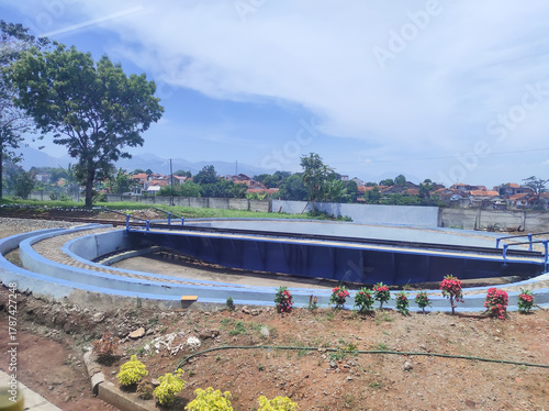 A blue railway turntable for locomotives at a locomotive depot. A locomotive turntable is a device used to turn trains so they can reverse direction. Infrastructure and technology at a train station