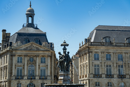 Canvastavla Close up of Three Graces Fountain between historic buildings at Place de la Bour