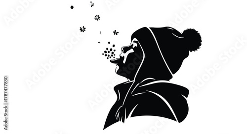 Joyful child in winter hat catching snowflakes on a white background