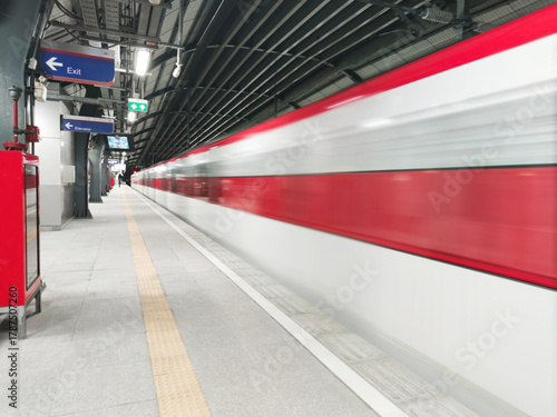 The electric train with motion blur Forward on rail tracks in the station with blank passenger. Speed train concept.