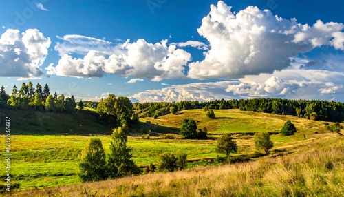 Rolling hills and meadows under a bright blue sky with fluffy white clouds, nature's beauty