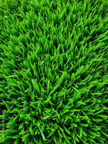 Abstract close-up of synthetic turf fibers, revealing a complex yet uniform green texture suitable for backgrounds and design,  natural,  sophisticated