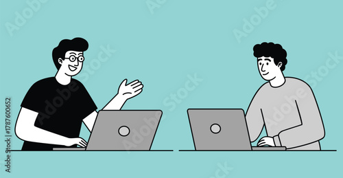 Two Young Professionals Collaborating on Laptops