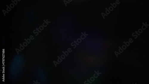 Sun glare, lens flare on a black background for transition to video. Colored rays	