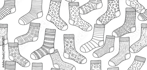 A delightful seamless hand-drawn pattern in black and white, featuring a diverse collection of uniquely patterned socks, ideal for textile, apparel, and digital background designs