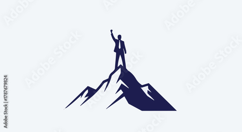 Determined businessman celebrates achievement atop a majestic mountain peak