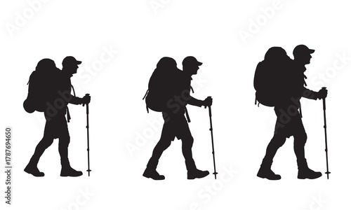 Hikers with backpacks and trekking poles silhouette