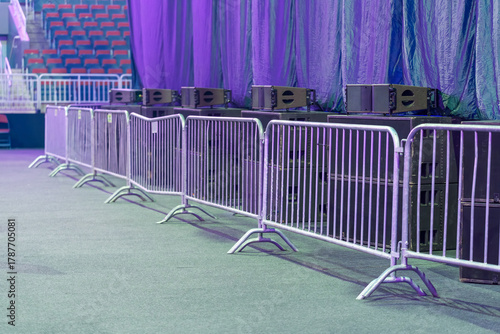 Metal fence installed in the venue for crowd control, safety, and defining event areas