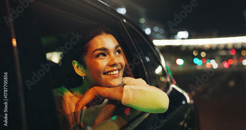 Happy, woman and window of car at night for travel, sightseeing city and tourism holiday. Smile, passenger and thinking in vehicle trip with fresh air, adventure and urban view for evening journey