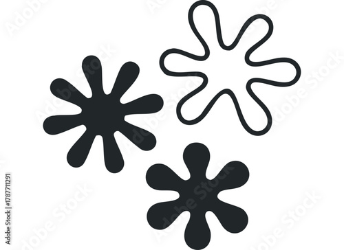 Three abstract organic shapes in black and white