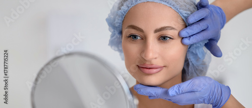 Young woman with mirror and...