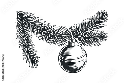 Christmas ornament hanging from pine branch