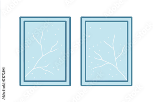Two window panes with delicate frost patterns and falling snow