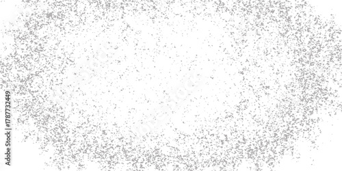 Abstract black and white grunge background with a dirty wall texture and paint splash on a gray surface