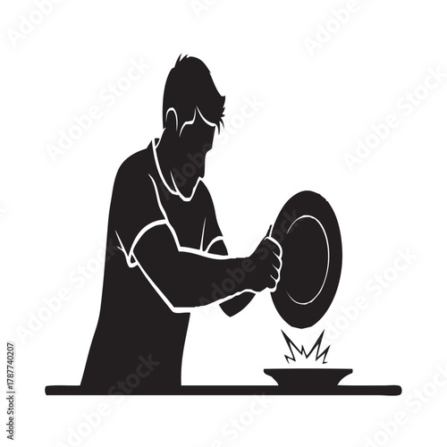 Silhouette of Man Washing Dishes in Kitchen