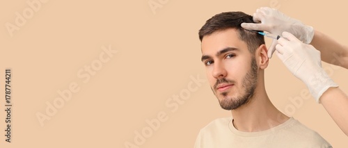 Young man receiving injecti...
