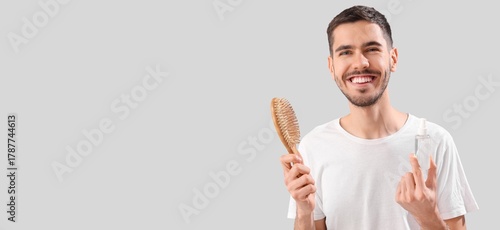 Happy young man with brush ...